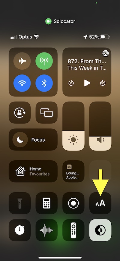 Yellow arrow pointing to text size button in control centre.