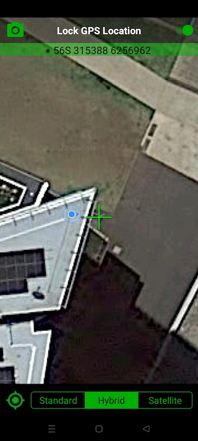 Crosshair locked in position next to building.